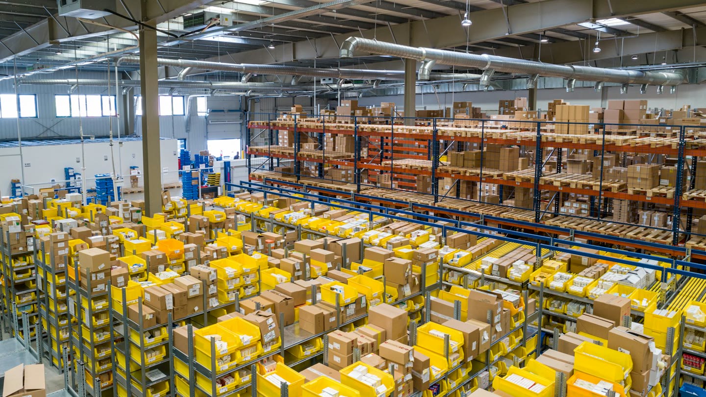 Warehouse aisles packed with boxes waiting to be picked