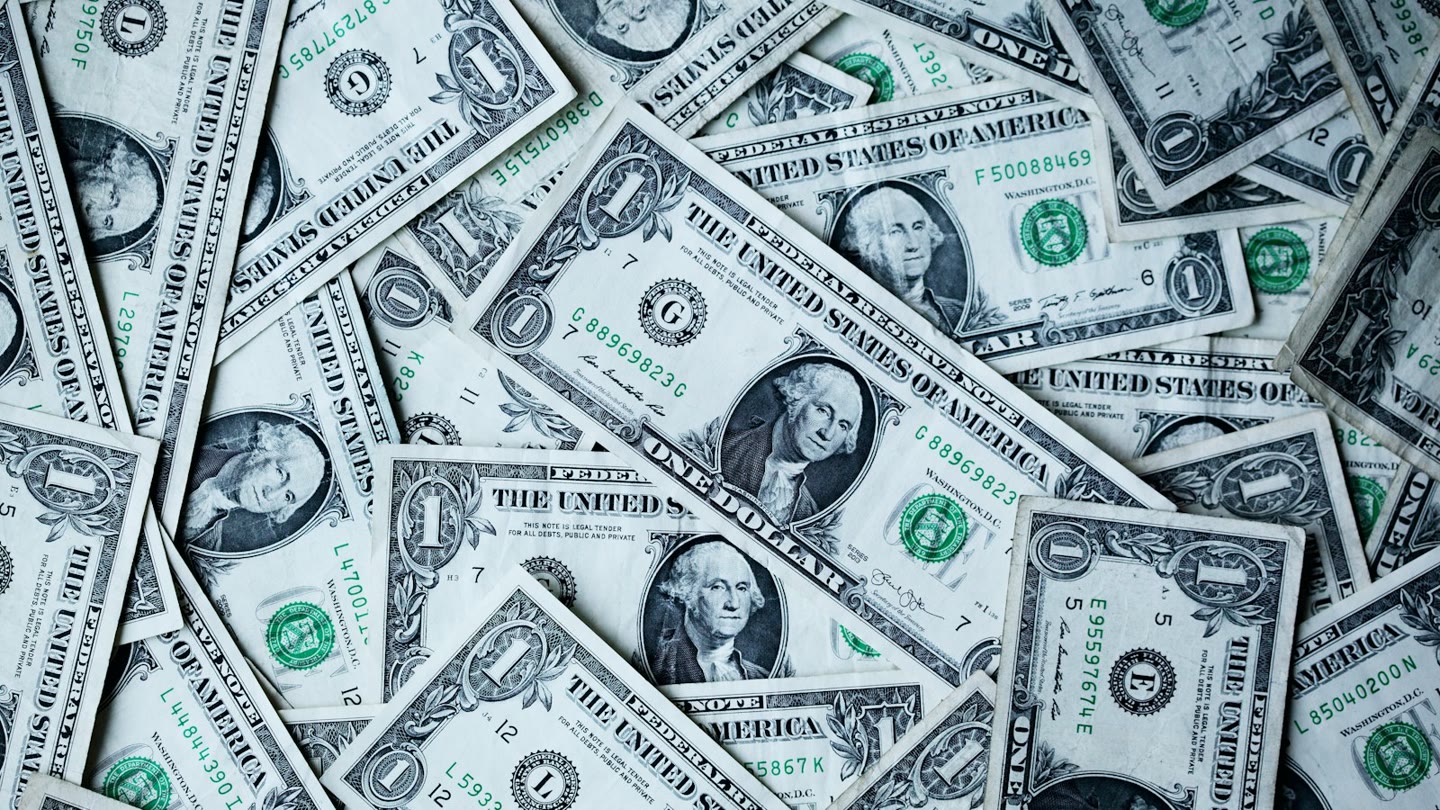 Scattered United States one-dollar bills