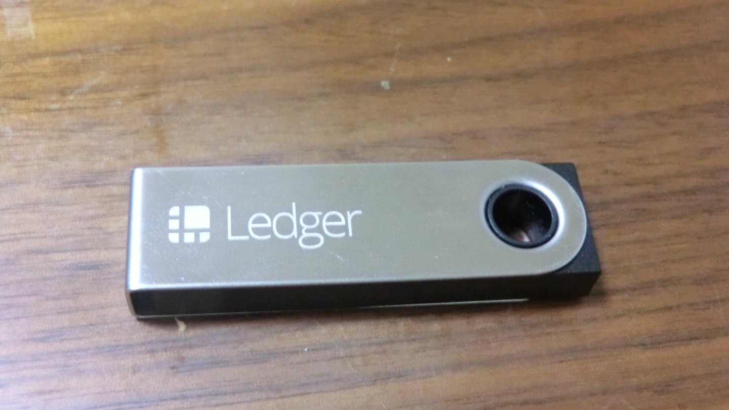 Ledger Nano S hardware wallet on a wooden table